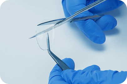 View of Tissue Tape held by forceps.